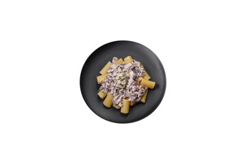 Obraz na płótnie Canvas Delicious fresh pasta with champignon mushrooms in a creamy sauce