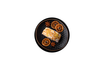 Delicious, fresh, sweet meringue roll with cream, almond chips, nuts and berries