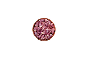 Fresh raw chicken or turkey hearts in a ceramic plate with salt, spices and herbs