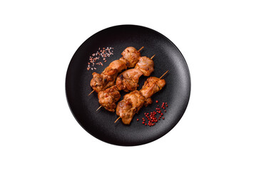 Delicious fresh, juicy chicken or pork kebab on skewers with salt and spices