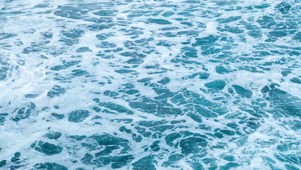 Beautiful blue wave water for abstract background from natural sea ocean in summer, motion texture pattern from outdoor seascape beach travel, aerial view bright splash surface beauty lanscape