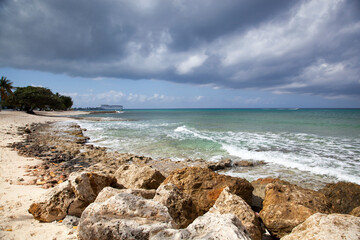 Fototapeta na wymiar Grand Cayman Island Beach Under The Rainy Sky