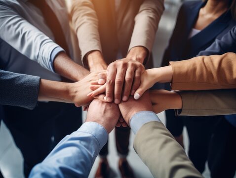 Diverse business people group put hands together in stack pile at training as concept of sales team corporate unity connection, teambuilding loyalty, support in teamwork