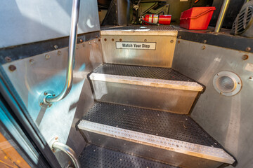 Fototapeta na wymiar steps Interior, inside, of a american school bus.