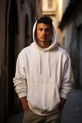 Rustic European Alleyway Mockup with Male Model in White Hoodie, Relaxed Pose