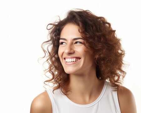 Happy woman smiling brightly infront of a white background isolated