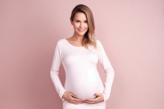 Pregnant woman holding belly with baby. Concept of pregnancy, health care, gynecology, medicine. Young mother waiting of the baby. Close-up, copy space, indoors.