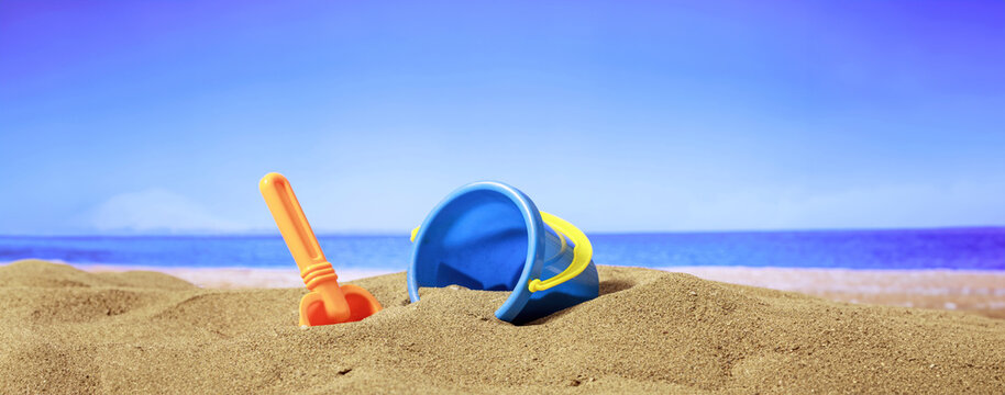 Summer vacations - Bucket on a sandy beach