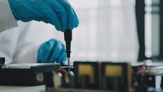 Debugging electronics device. PCB witch microcontroller in electronics laboratory