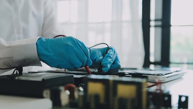 Debugging electronics device. PCB witch microcontroller in electronics laboratory