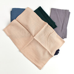Napkins and towels on white background. Kitchen textiles, top view