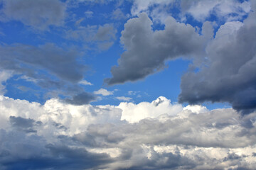 beautiful cloudscape with black and white clouds and blue sky wallpaper   