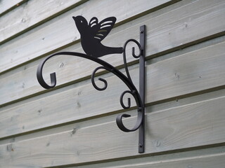 Bracket for hanging flower pots or baskets. Decorative wall hook made from solid metal. Home and...