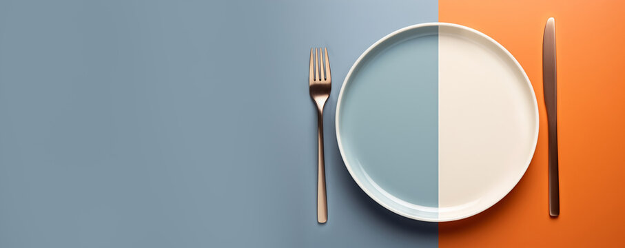 Blank plate with knife and fork on blue and orange background. Close up. Dining table. Copy space. Banner for design. AI generated