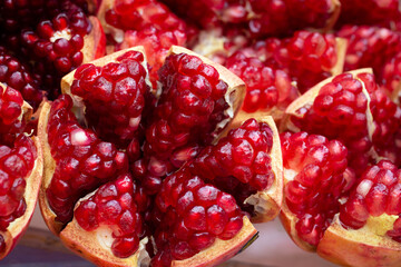 A pomegranate has been peeled to reveal the bright red interior that is delicious to eat. There are many types of antioxidants. Relieves heart disease and high blood pressure
