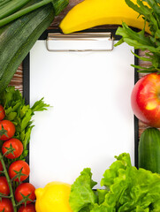 Blank notepad and healthy food. Diet, meal plan. Healthy food concept. Top view. Copy space.