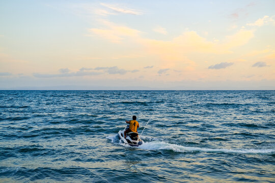 ride a jet ski on the beach, sunset over the sea, sunset in the sea, sea and sky, sunset over sea, beautiful sunset sky, blue and orange sky, sunset wallpaper