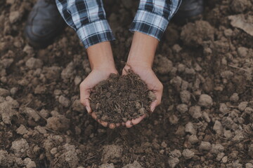 Symbol heart earth day. Handful of dirt hands heart shape. Farm organic earth. Farmer hands soil...