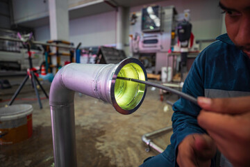 A man starts using a weld pipe stainless inspection camera. The light monitor shows images from the...