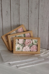 Homemade marshmallows in a paper gift box. Zephyr flowers.
