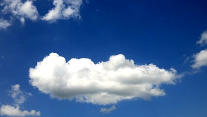 A serene and tranquil scene, with the sky mirroring a pristine lake, adorned with the gentle ripples of wispy clouds