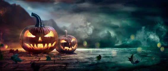 Foto op Plexiglas Halloween Pumpkins In A Spooky Night With Abstract Defocused Light And Smoke Effects © Romolo Tavani
