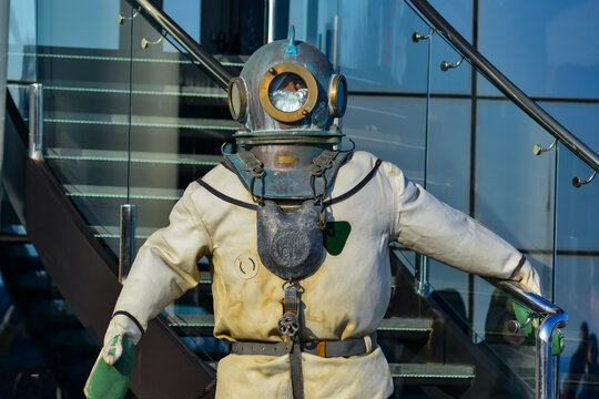 old three-bolt diving suit of a heavy diver with a copper helmet in Odessa
