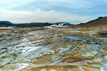 Hverir, Iceland. A surreal, bare orangy-red, geothermal area at the foot of Namafjall. Full of fumaroles, mud pools, steam vents. It's on Route 1. It is also called Namaskard Hverir.