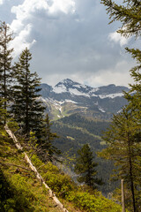 Close Up of a Mountain in the Swiss Alps in Switzerland in the Summer with Clouds in the Background