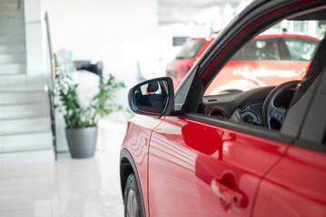 red car in showroom selling vehicles