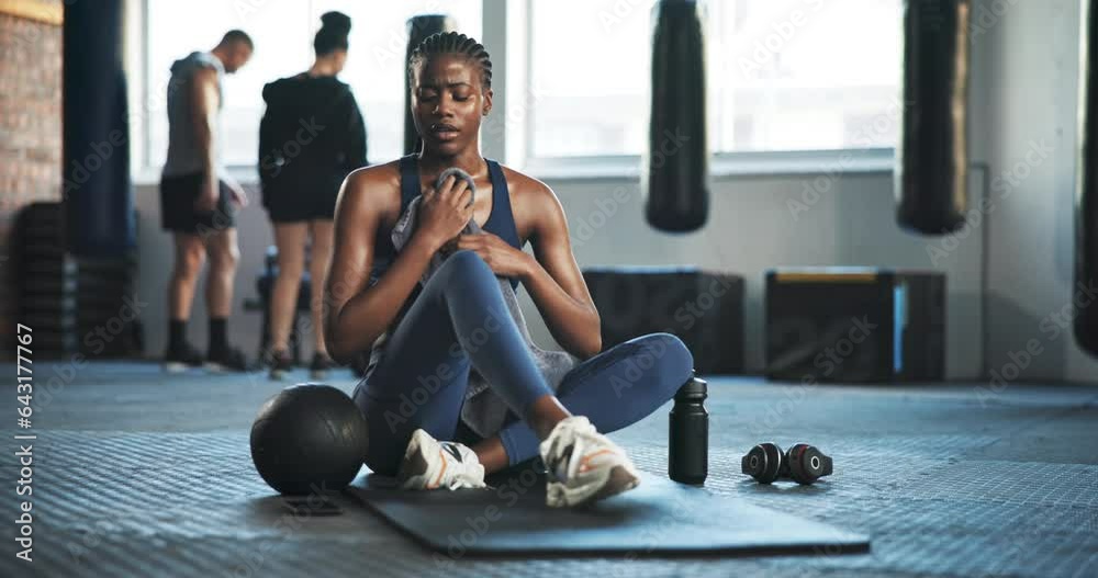 Canvas Prints Tired, sweat and woman with towel at gym for exercise, fitness and break from cardio workout. Exhausted african lady breathing for recovery, performance challenge and training fatigue in health club