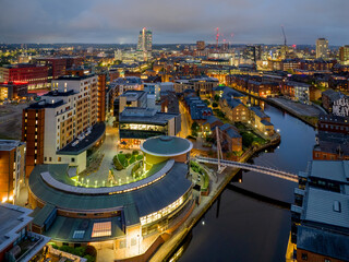 Leeds, West Yorkshire, England. Leeds city centre aerial view looking over the river Aire towards the city, Bridgewater place and Leeds train station at dusk