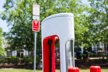 EV charging: sustainable, eco-friendly future. Electric vehicles and green energy infrastructure pave the way for cleaner air and a greener environment, reducing our carbon footprint