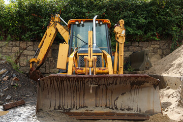 Construction machinery symbolizes progress and teamwork, shaping the future by building the...