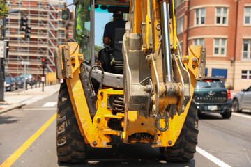 Construction machinery symbolizes progress and teamwork, shaping the future by building the...