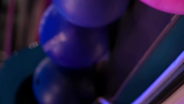 Сlose-up hand taking a bowling ball, vertical