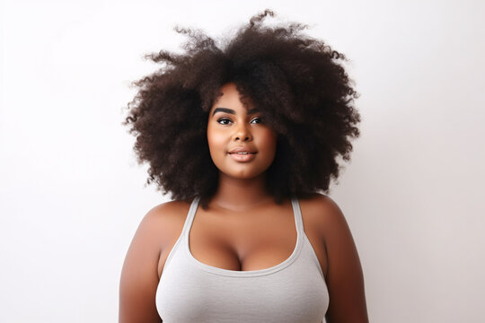 Beautiful plus size afro american woman isolated on a white background