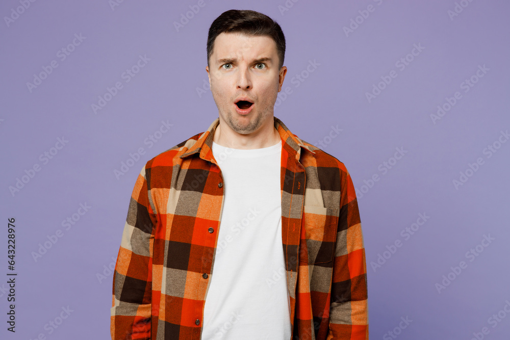 Wall mural Young angry mad furious shocked man wears checkered shirt white t-shirt casual clothes look camera with opened mouth isolated on plain pastel light purple background studio portrait Lifestyle concept - Wall murals