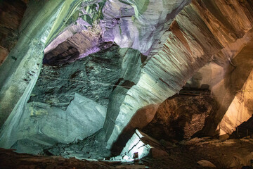 Illuminated Cave Walls: Varied Hues in Cave Interior