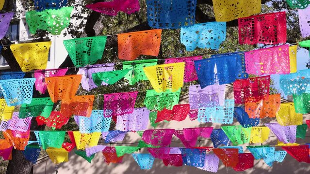 Colorful Mexican papel picado used to decorate for Dia de los Muertos. Festive