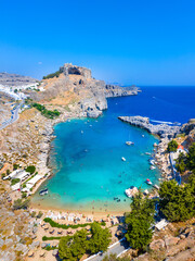 Panoramic view of St. Paul bay with acropolis of Lindos in background, Rhodes island, Greece