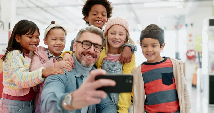 Teacher man, selfie and school kids with smile, classroom and happy with diversity, group and memory. Education, learning and mentor with photography, friends and development on social network app