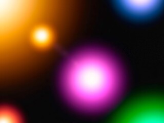 Various bokeh colors on a black background with pastel gradients of purple, green, yellow, pink, like stars in the galaxy.