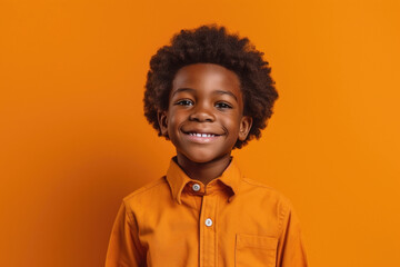 African kid on studio background, portrait of cute smiling black child