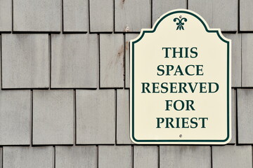 This space reserved for priest sign.