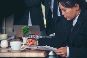 Businesswoman hands note meeting document in conference room. Woman Hands writing planning on notebook. Female hand holding pencil write on diary sketchbook. Business Planning Concept.