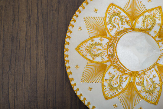 Mexican charro hat on wooden table. Mariachi hat. Typical mexican sombrero.