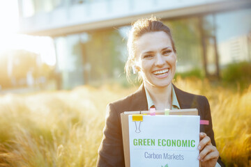 smiling modern female employee near business center