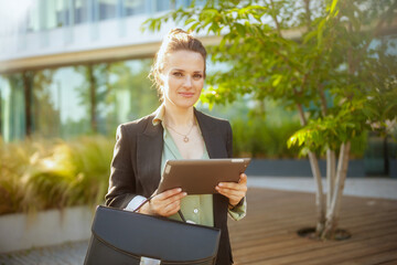 modern woman worker in business district using tablet PC