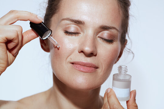 relaxed modern woman with cosmetic elixir
